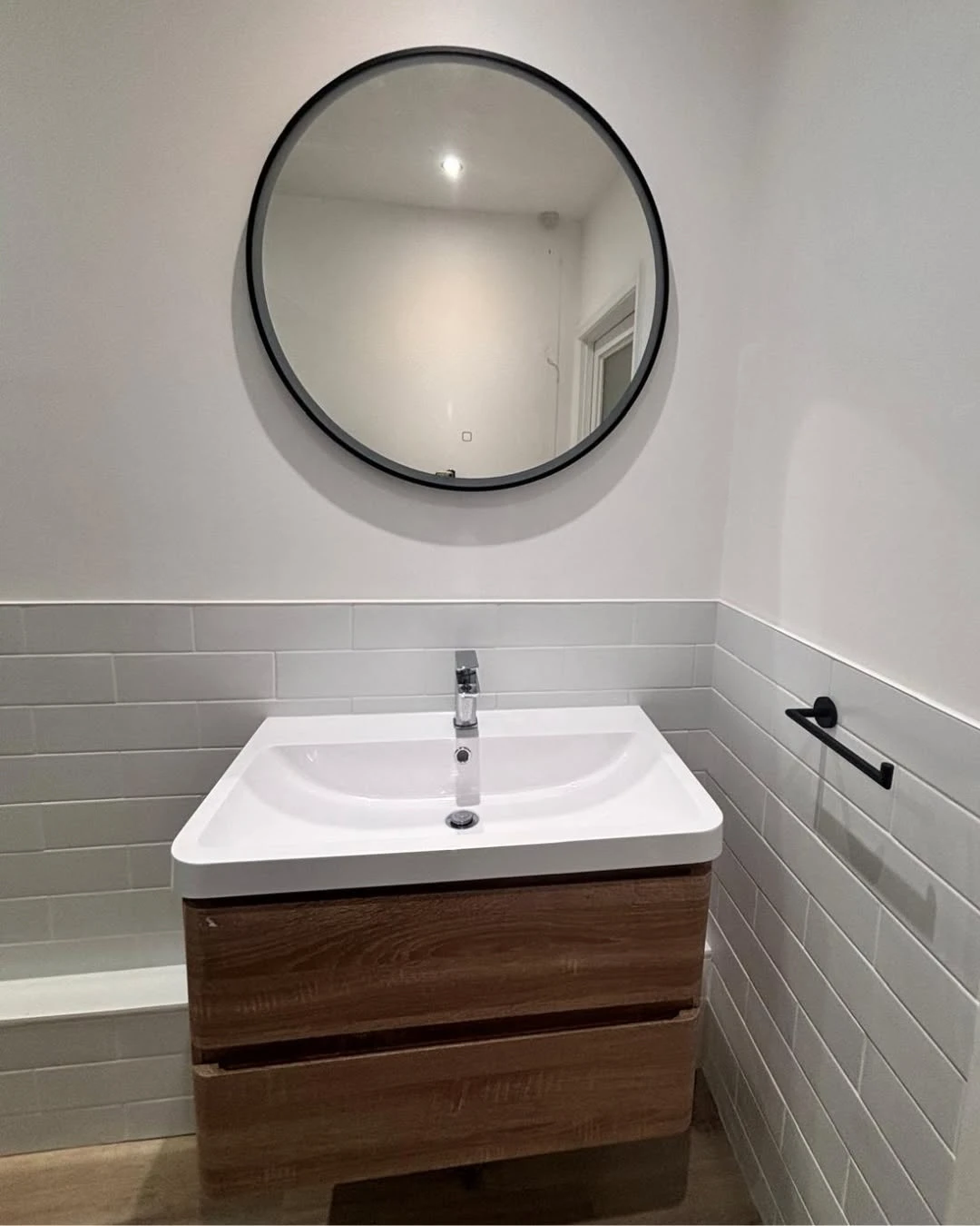 sink basin with mirror above